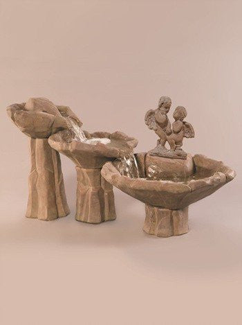 A tiered garden fountain with water flowing down each level.