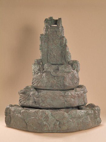 A tiered outdoor fountain made of corner rocks.