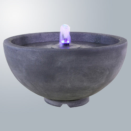 A tabletop fountain with water flowing