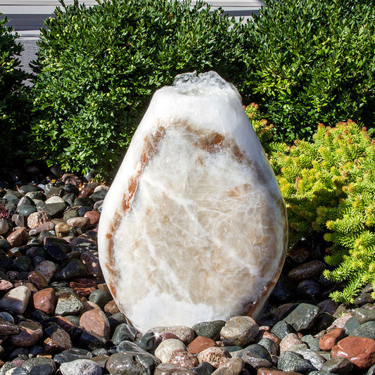 Red onyx fountain shaped like an almond
