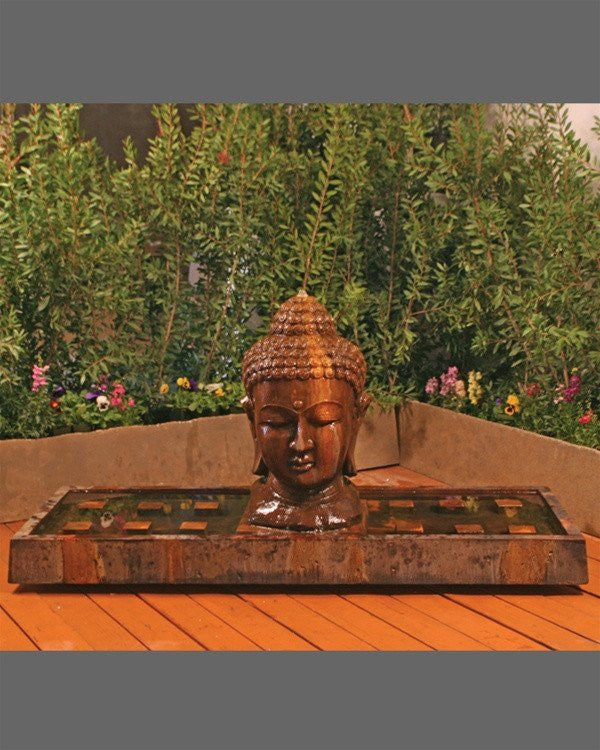 Large outdoor fountain shaped like a Buddha head