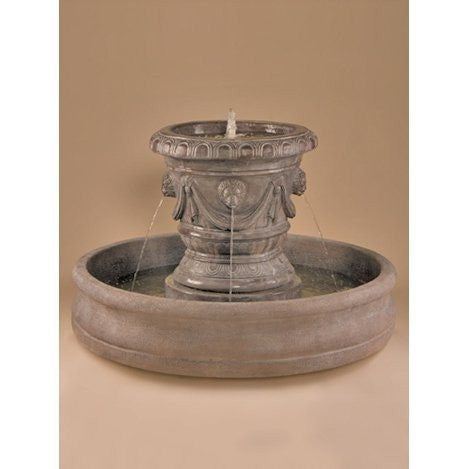 Outdoor fountain with lion heads on a Classico pot.