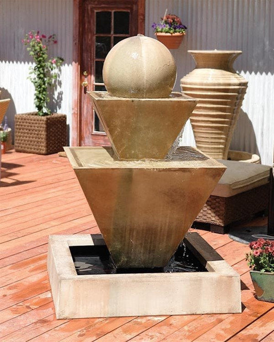 Outdoor water fountain with a double oblique design and a ball feature.
