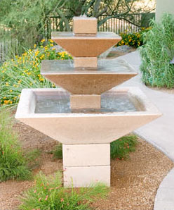 Three-tiered concrete fountain with an oblique design